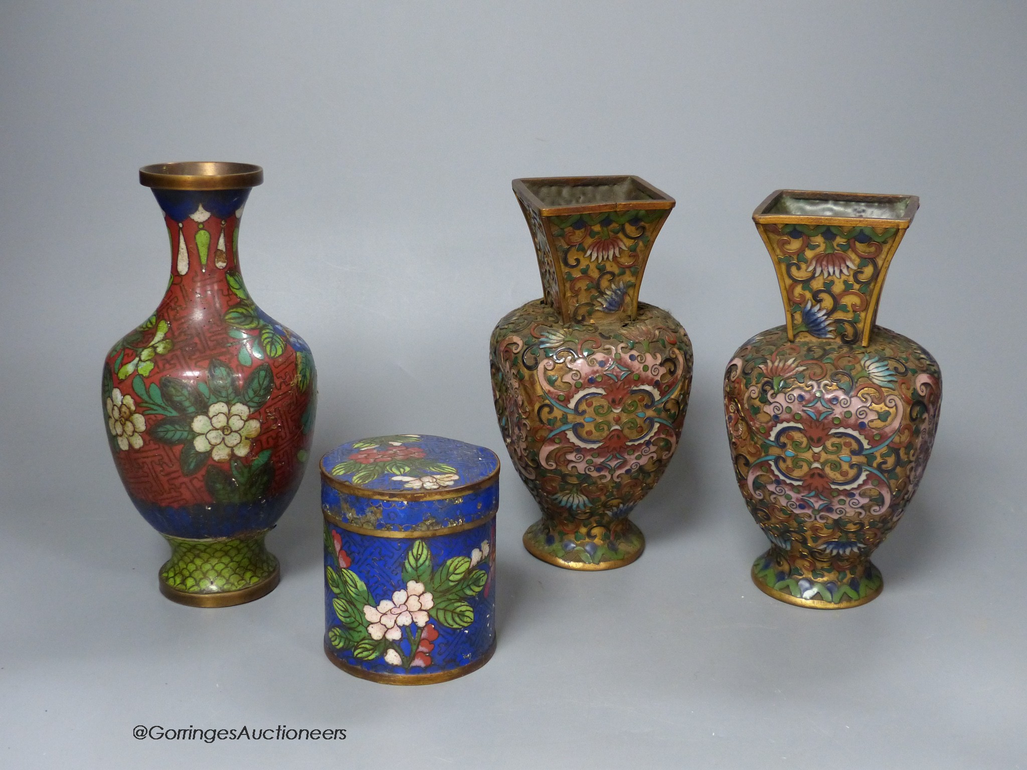 A pair of Chinese gilt ground cloisonné enamel vases, 16cm high a similar jar and cover